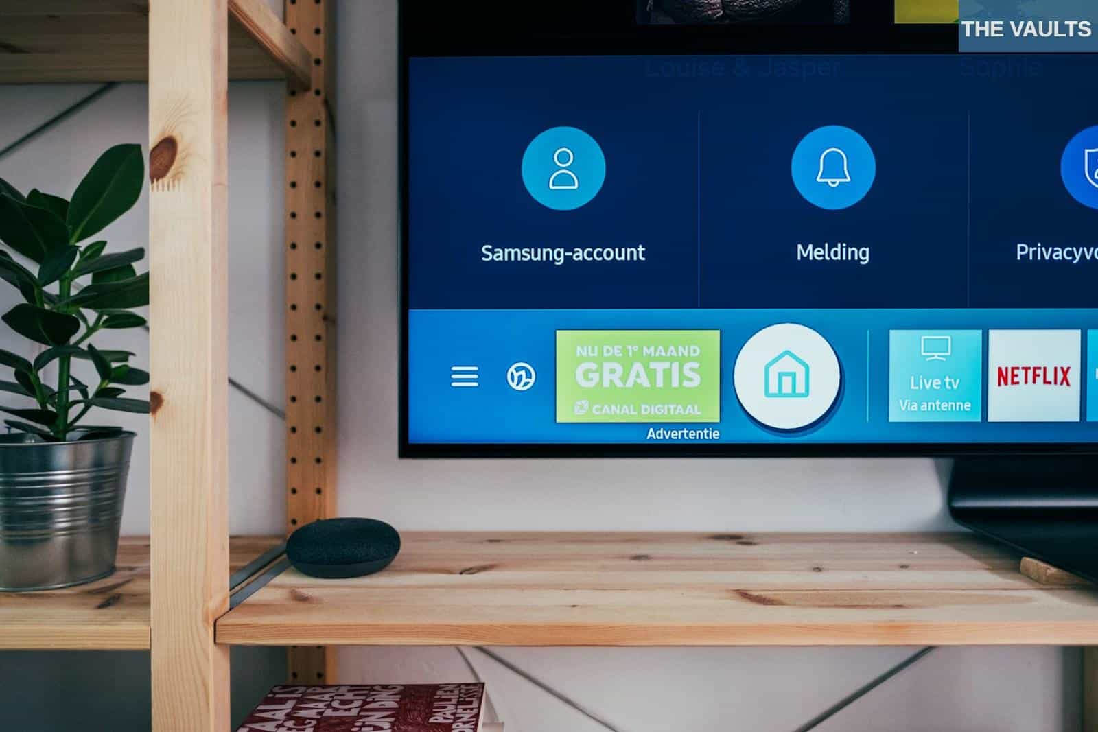 black flat screen tv on brown wooden tv rack