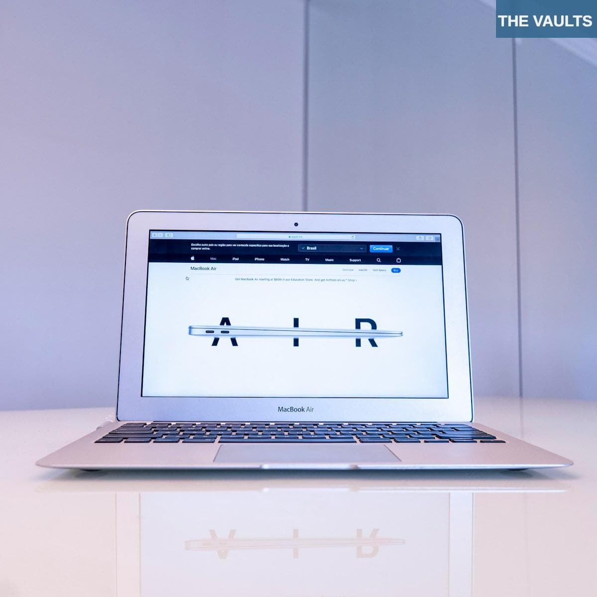 macbook air on white table