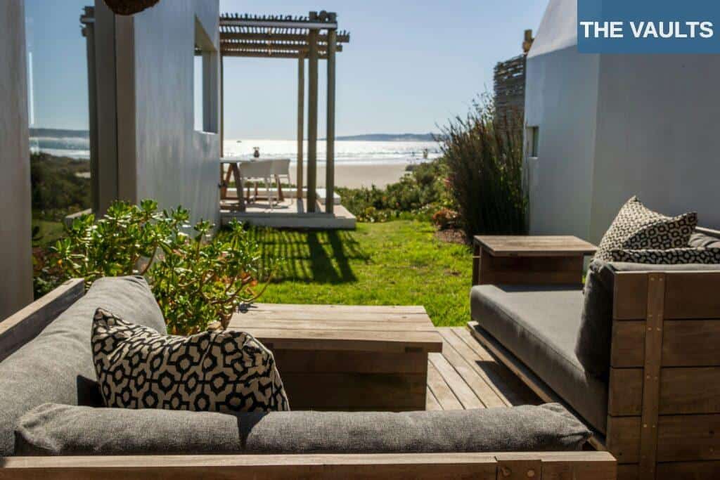 A couch and some chairs on a deck