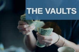 focus photography of person counting dollar banknotes